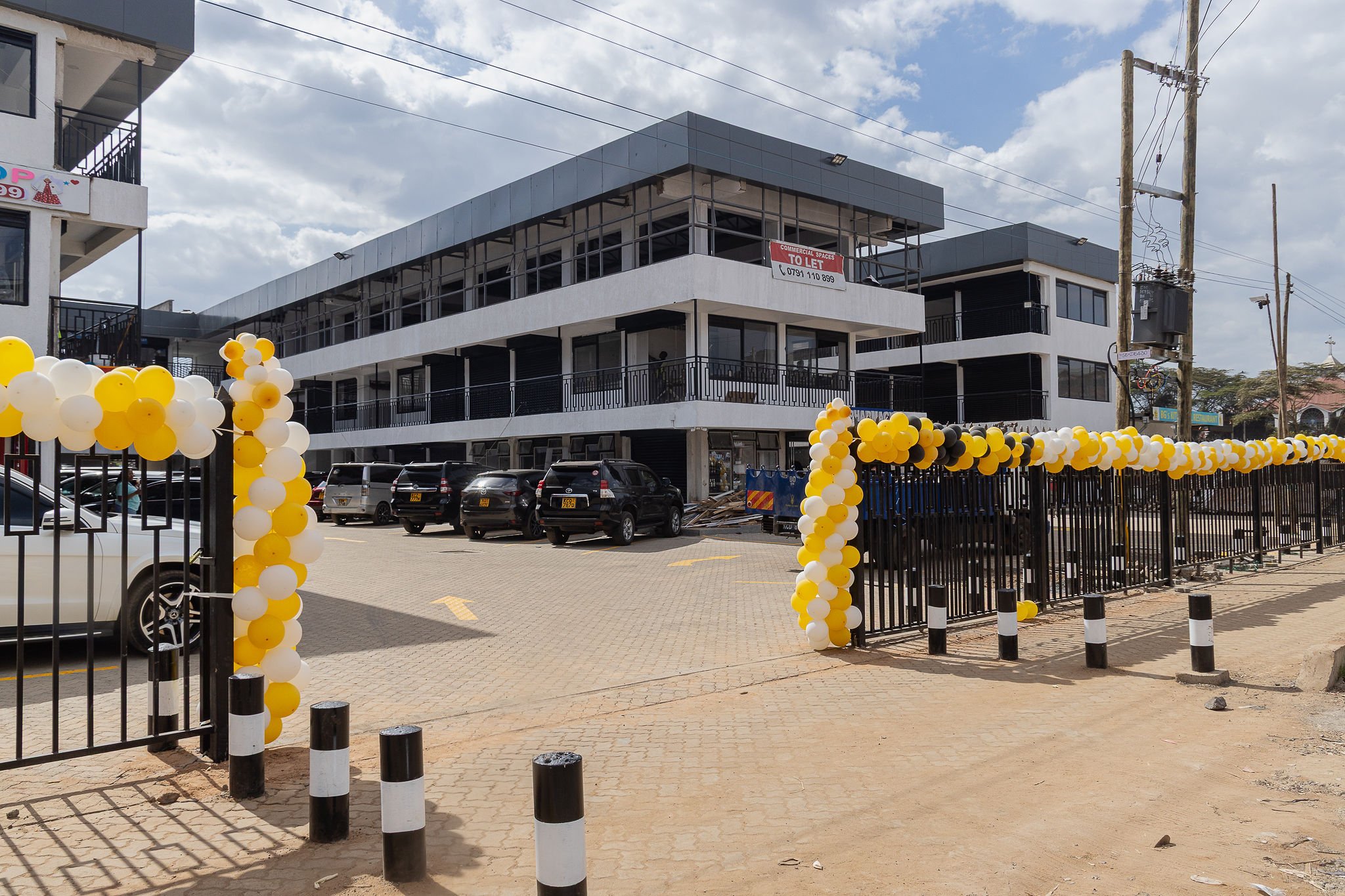 Exterior of the newly launched Neema Business Center in Zimmerman, decorated for its opening